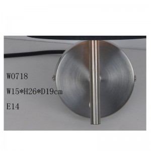 lampada da parete con paralume in tessuto tagliato a laser